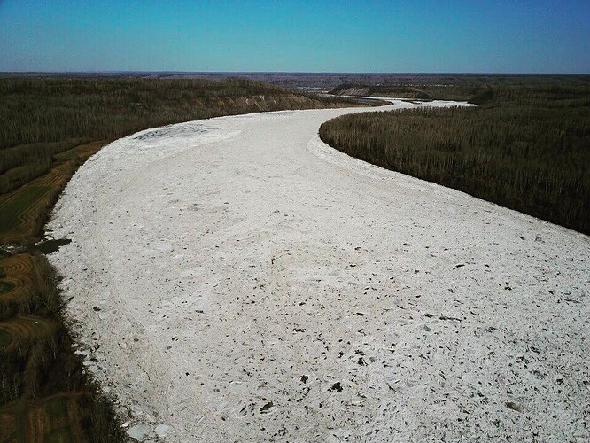 This is what the Athabasca River looks like south of #ymm today. Still some ice :-)