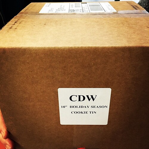 CDW 10″ holiday cookie tin.  Made of Aluminum.