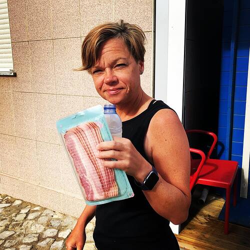 Walking around with a bottle of water and a package of bacon.  Gonna be a good day.